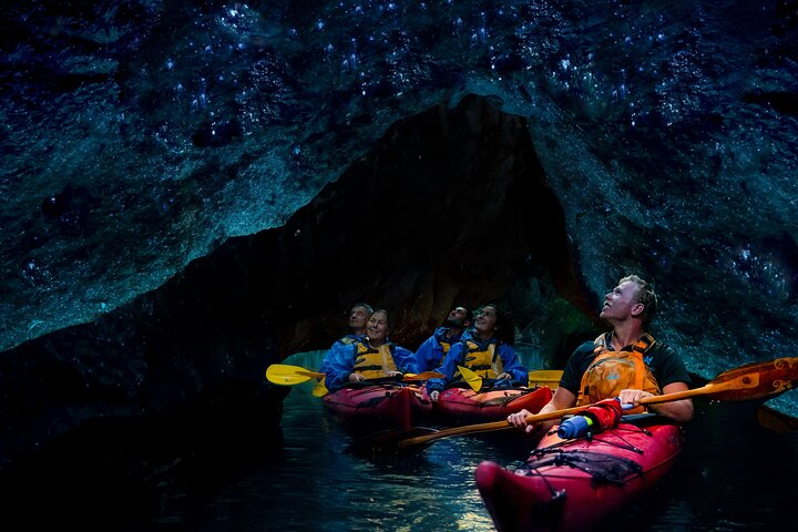 Paddle through Lake Rotoiti's serene waters discovering the magical Glowworm cave and unwinding in natural hot springs under a starlit sky creating unforgettable memories in nature's embrace.